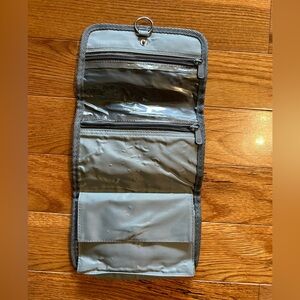 United airlines, small travel, accessory bag, folds & snaps and can be hangable.